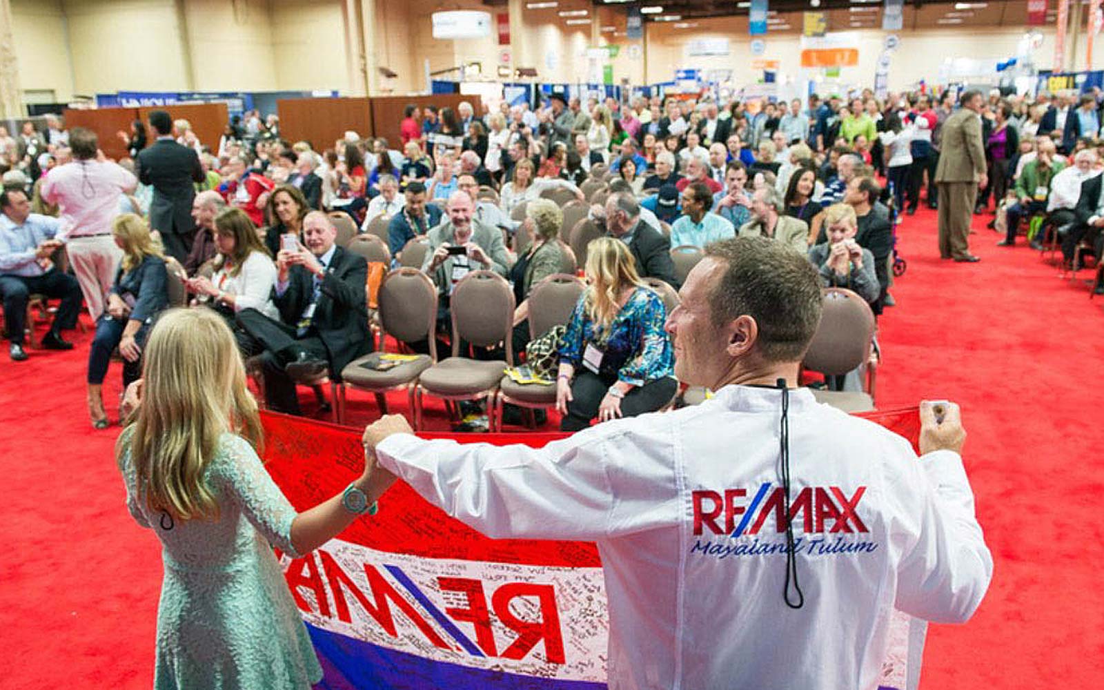 Bruce and Holly Johnson Remax Flag Presentation NAR